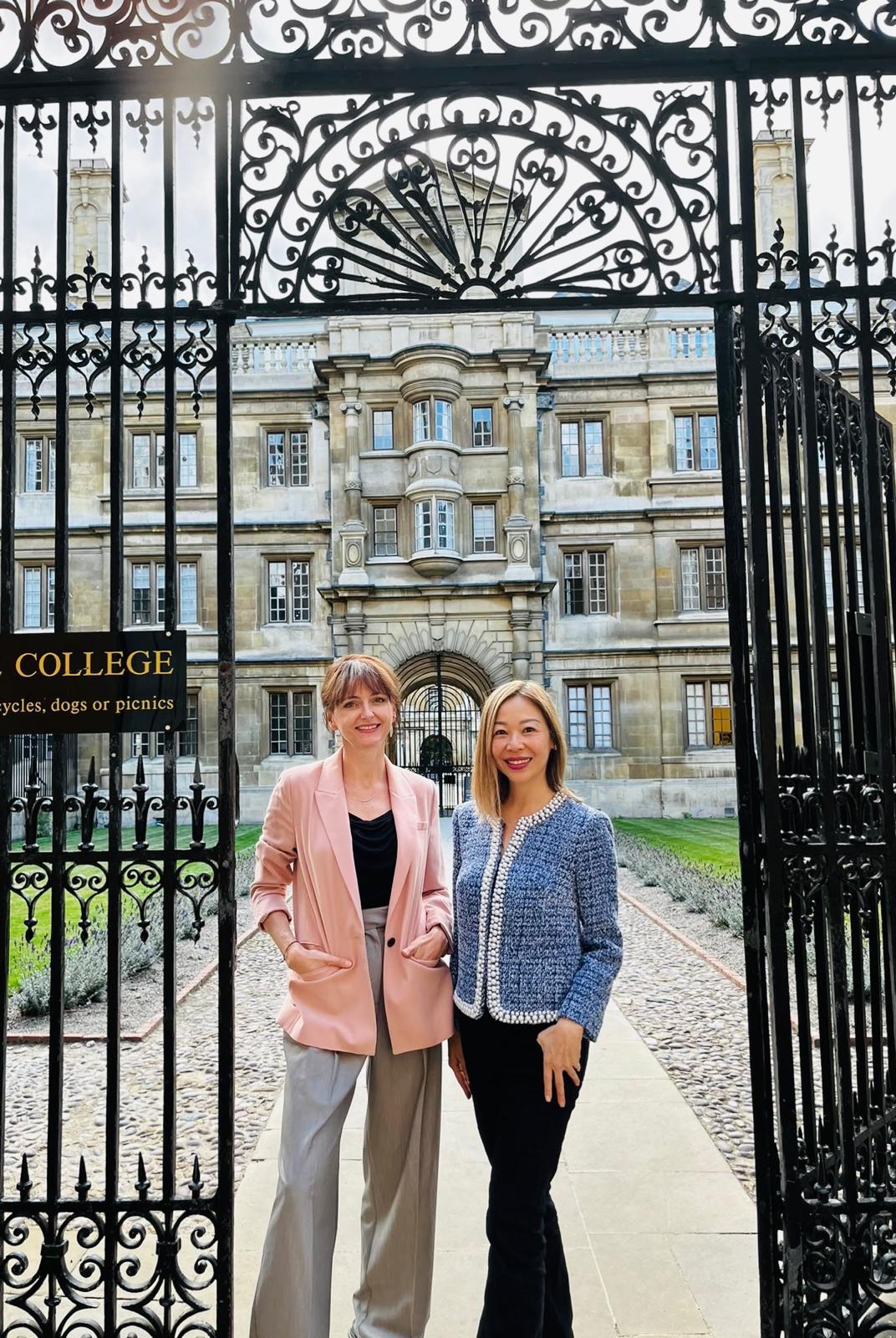 Facilitators Kasia Lanucha and Joanna Chin standing together at an open gateway
